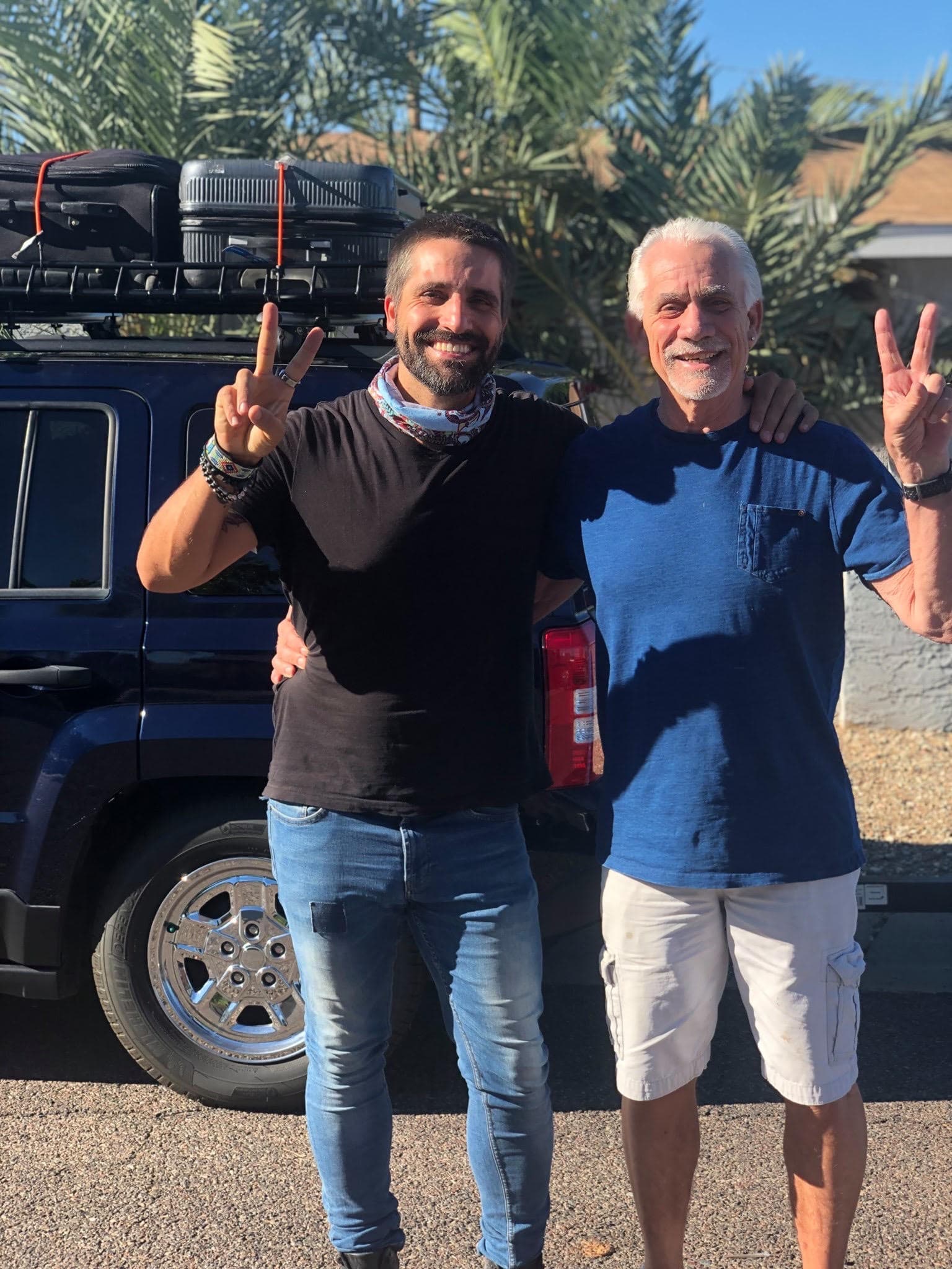 The builder and his father the day they left to drive to Mexico, the loaded car behind them.